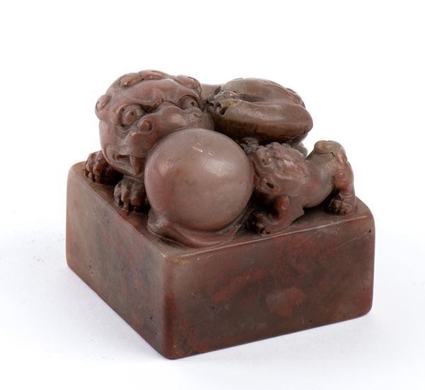 A STONE SEAL WITH BUDDHIST LIONS FINIAL