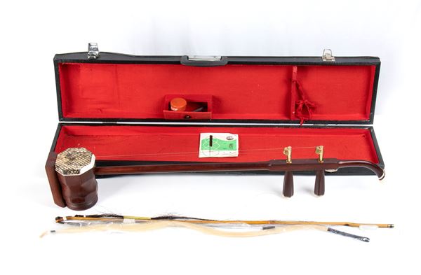 A WOOD AND LEATHER MUSICAL INSTRUMENT, ERHU