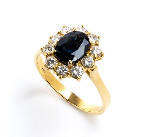 Gold sapphire and diamonds ring