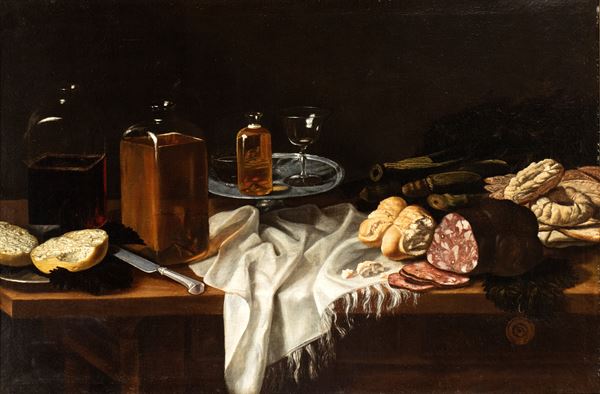 Artista emiliano, seconda met&#224; XVII secolo - Still life with salami, bread, coockies and glass bottles