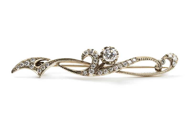 Spilla a barretta in oro argento e diamanti