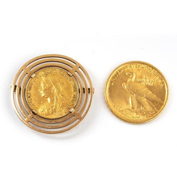 A gold pin set with a coin and and loose coin