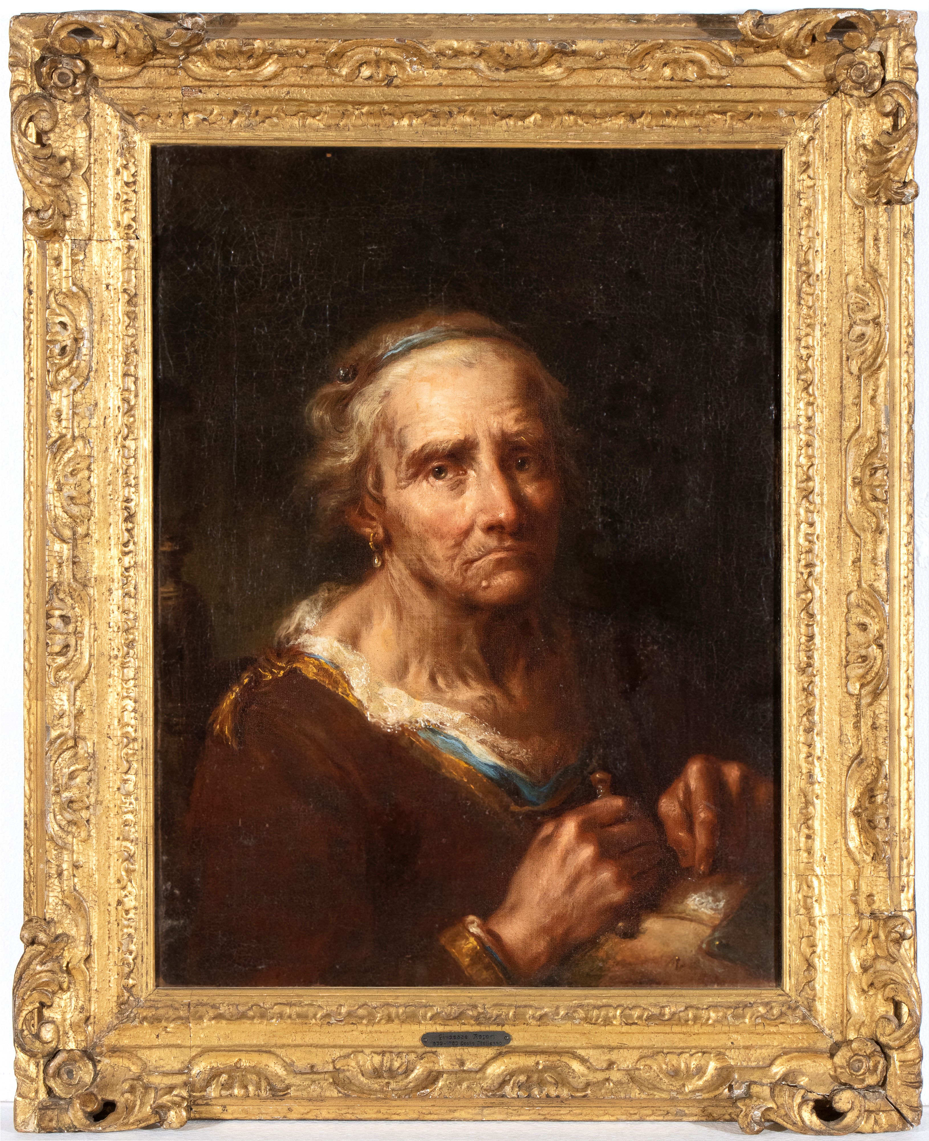 Ritratto di anziana che cuce