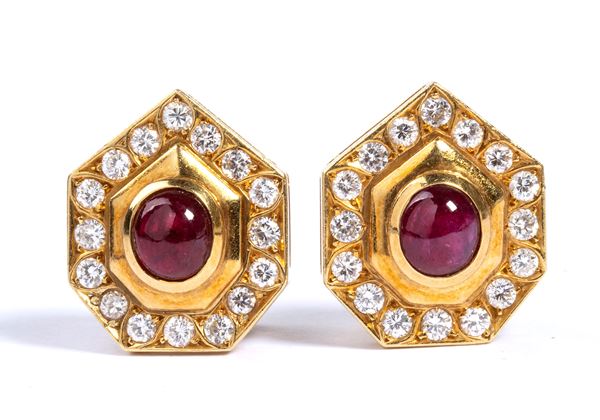 Pair of gold shield-shaped earrings with ruby and diamonds