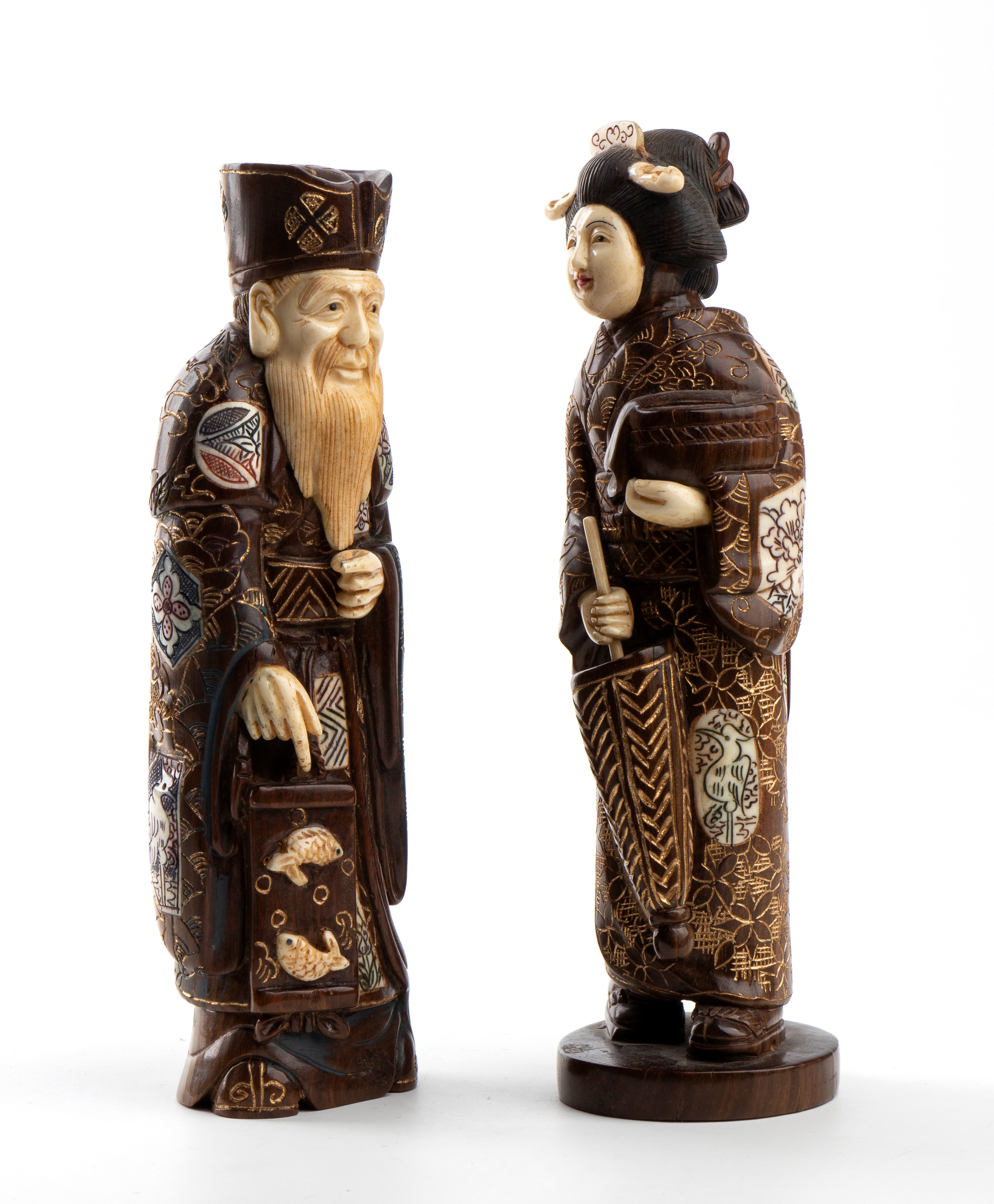 Okimono giapponesi in osso, Coppia di figure di anziano e donna, periodo Meiji