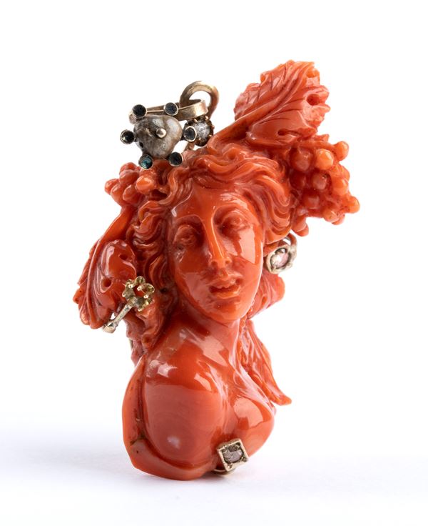 Coral female figure pendant