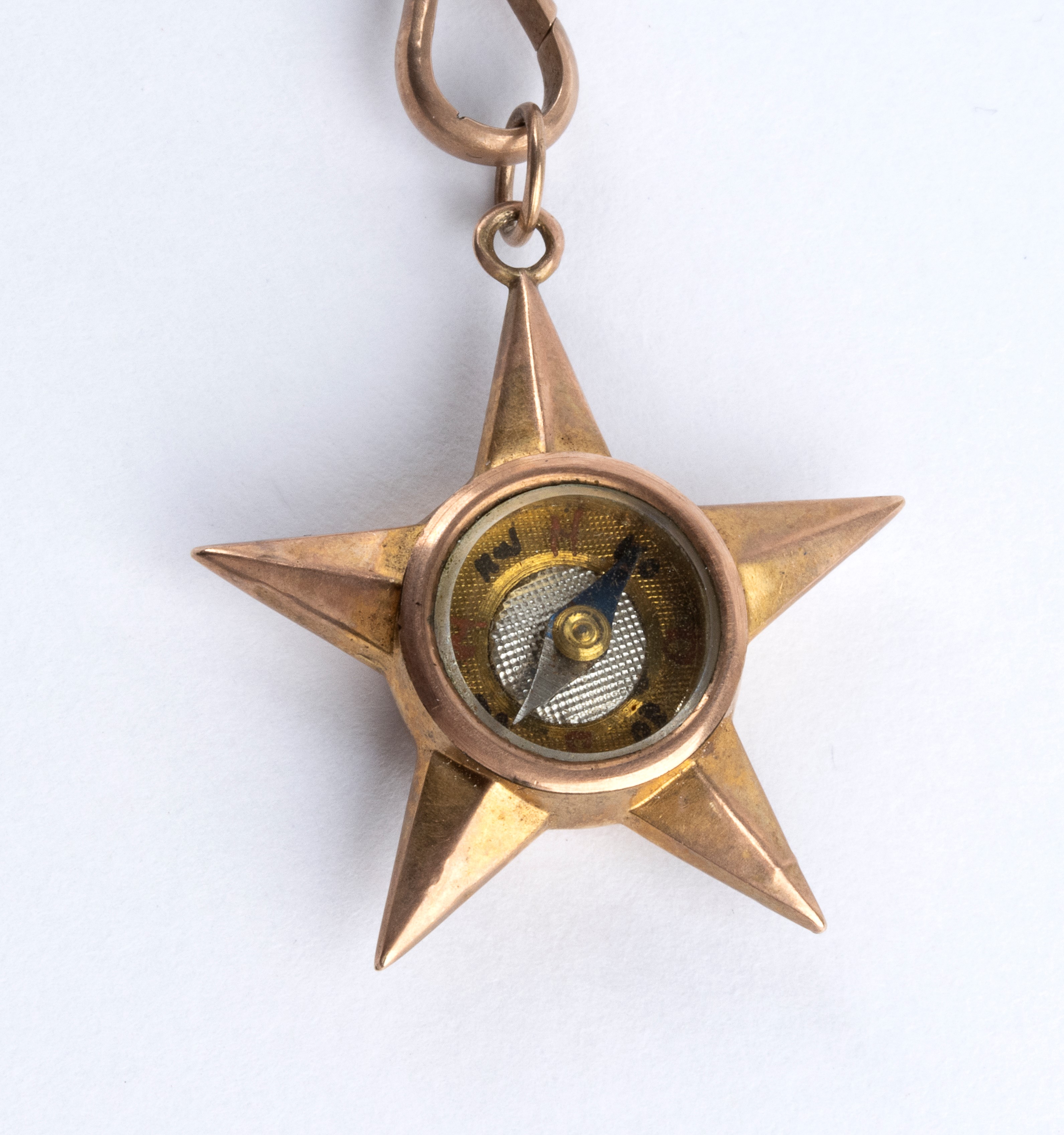 XIX secolo, Girocollo in oro a basso titolo con pendente a bussola stellata e saliscendi floreale