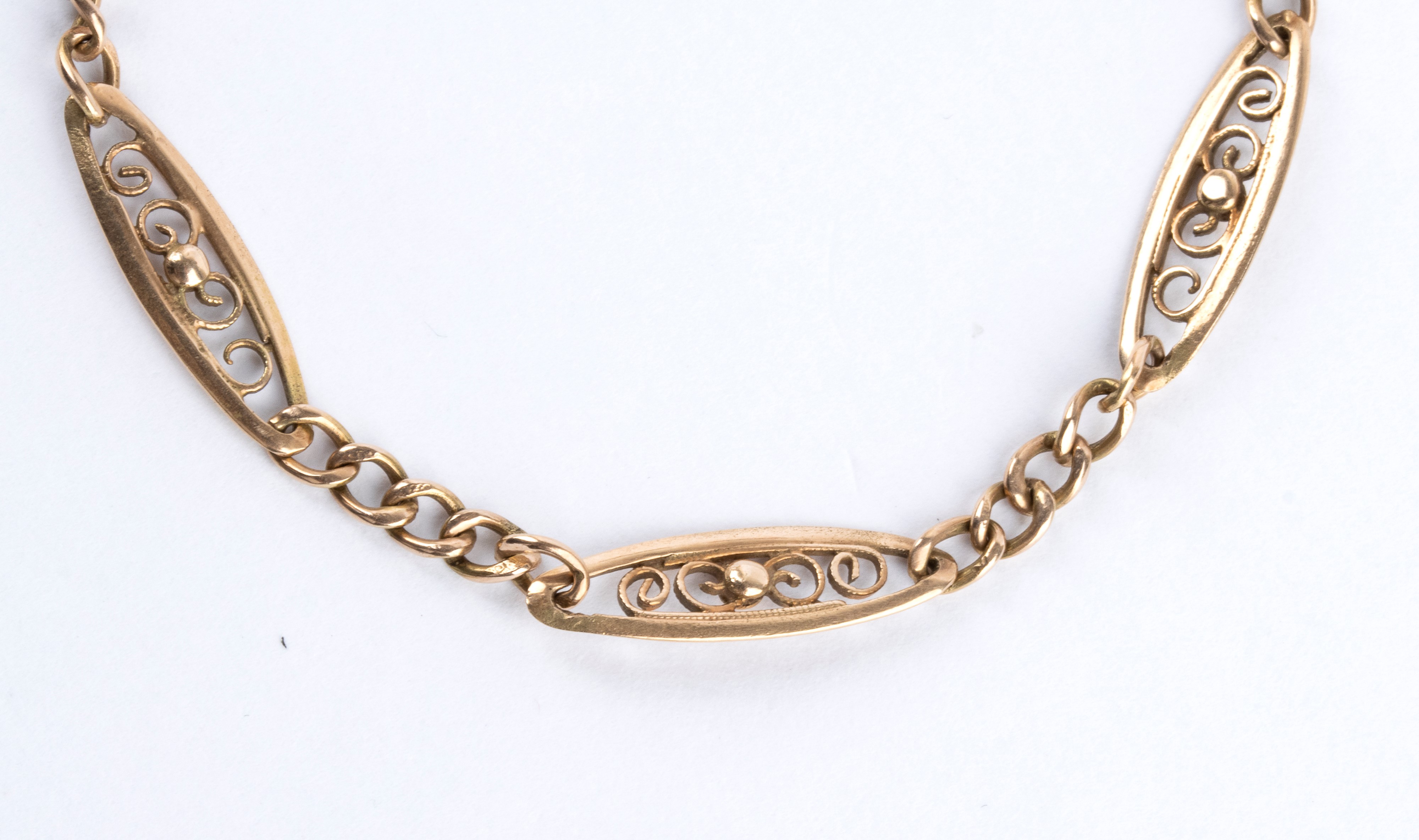 Catena per orologio in oro a rombi traforati con chiusura a moschettone