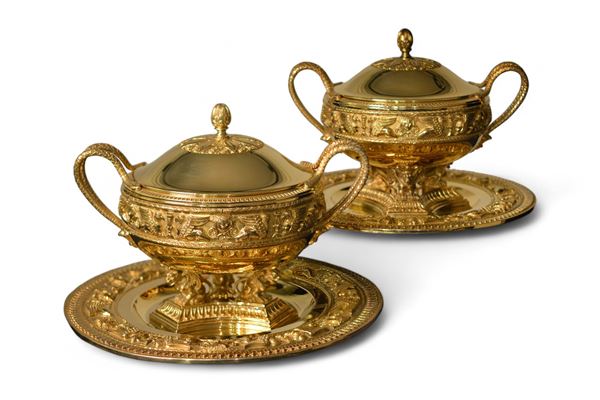 A pair of Italian gilded silver tureens with plates 