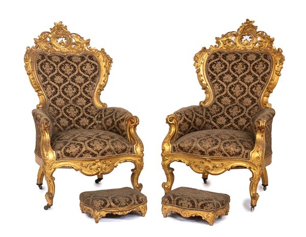 A pair of italian  armchairs with footstools