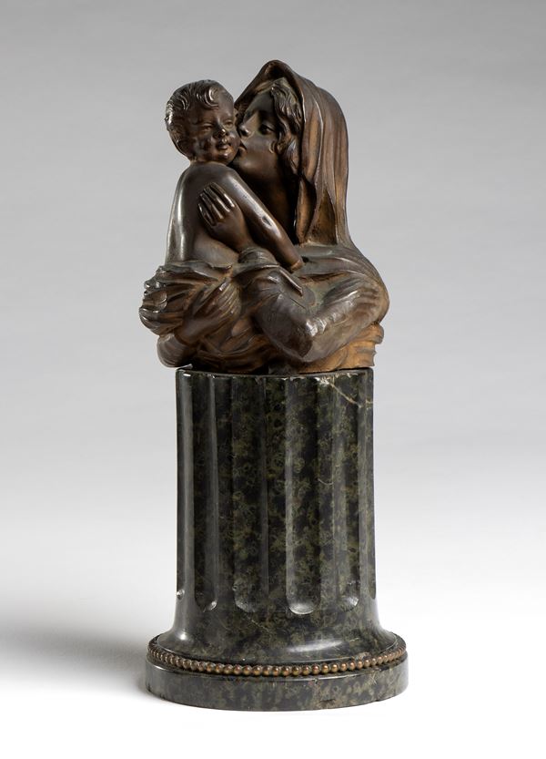 Bronze statue depicting Madonna and child 