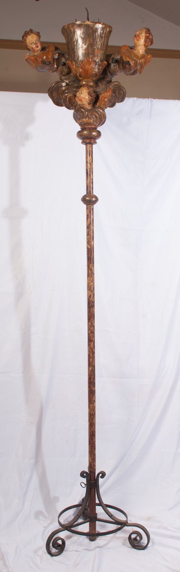 Candlestick on polychrome wooden rod
