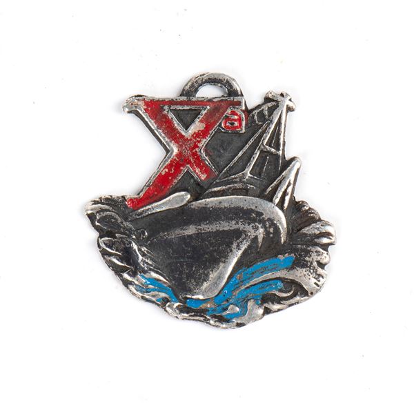 An X MAS badge