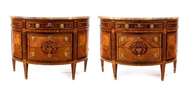 A pair of Italian demilune dressers