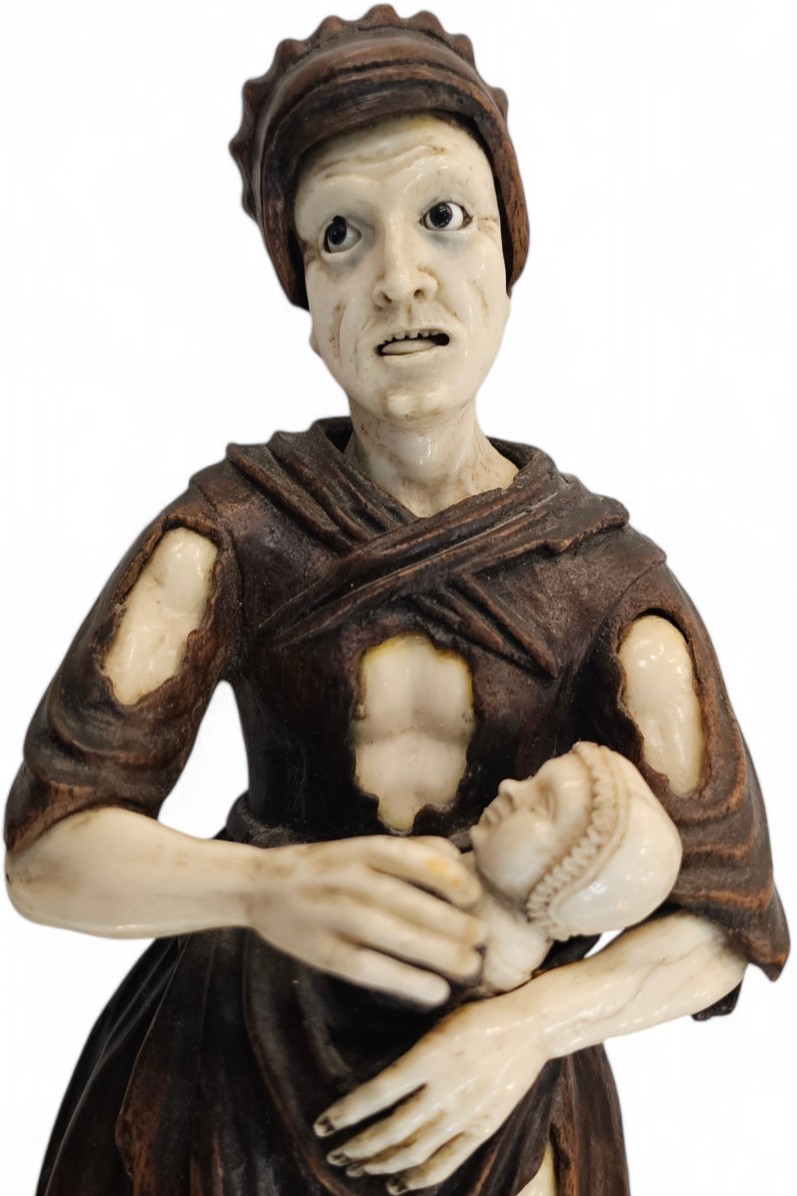 Coppia di mendicanti in legno e avorio