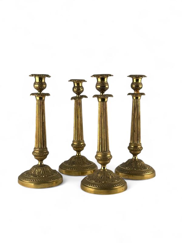 Lot of four French brass candlesticks