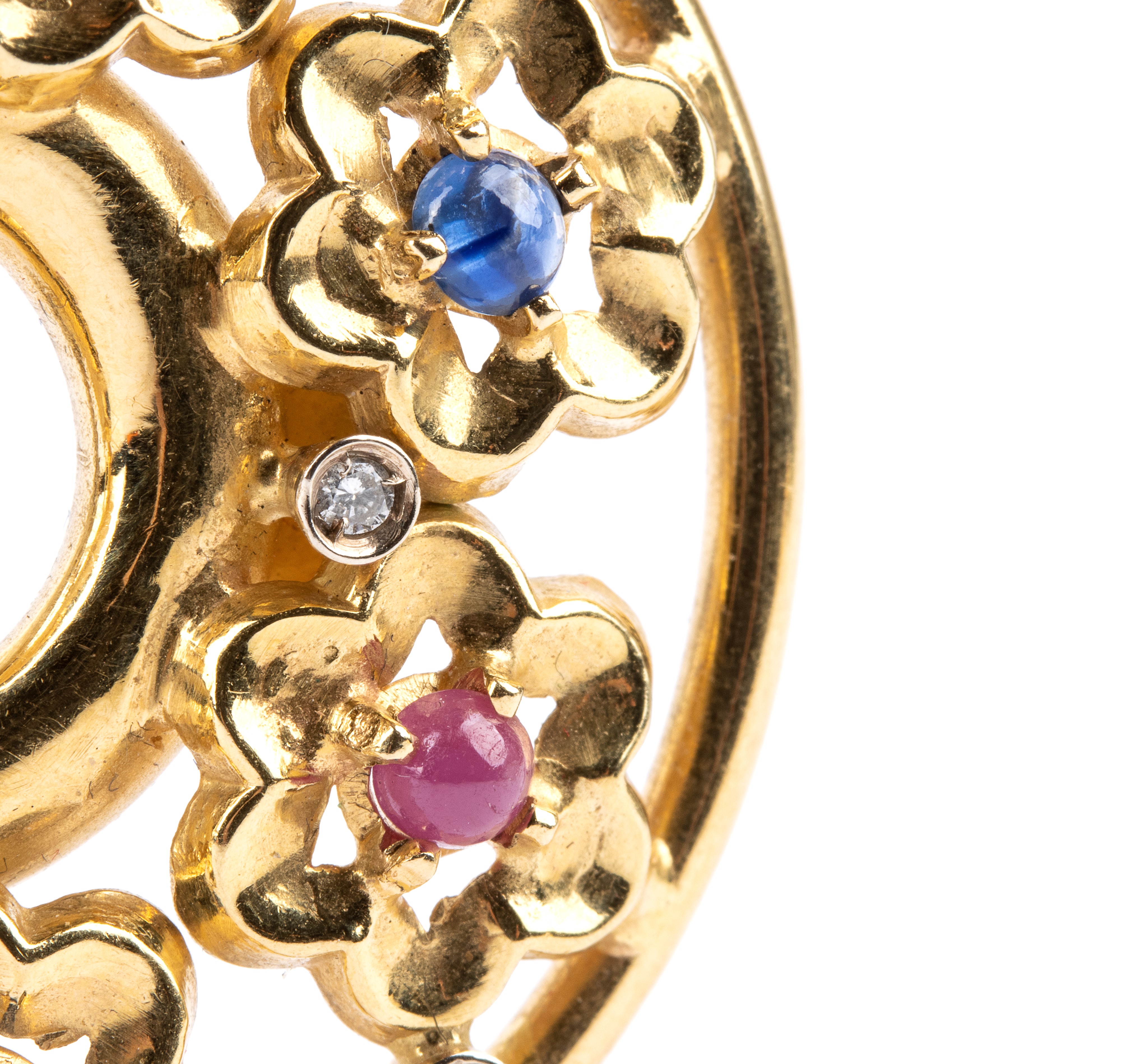 Paio di orecchini in oro e pietre preziose