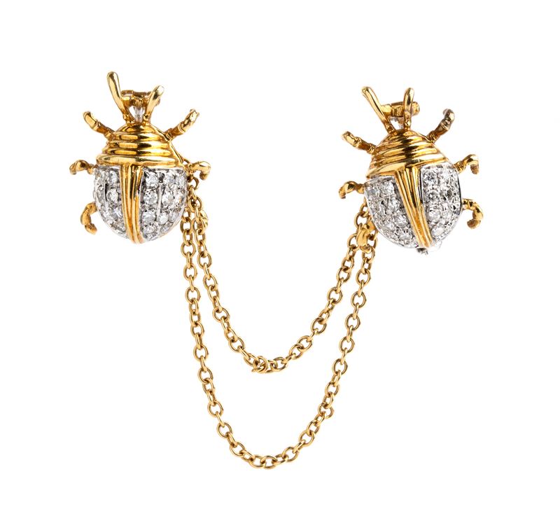 Doppia spilla in oro e diamanti