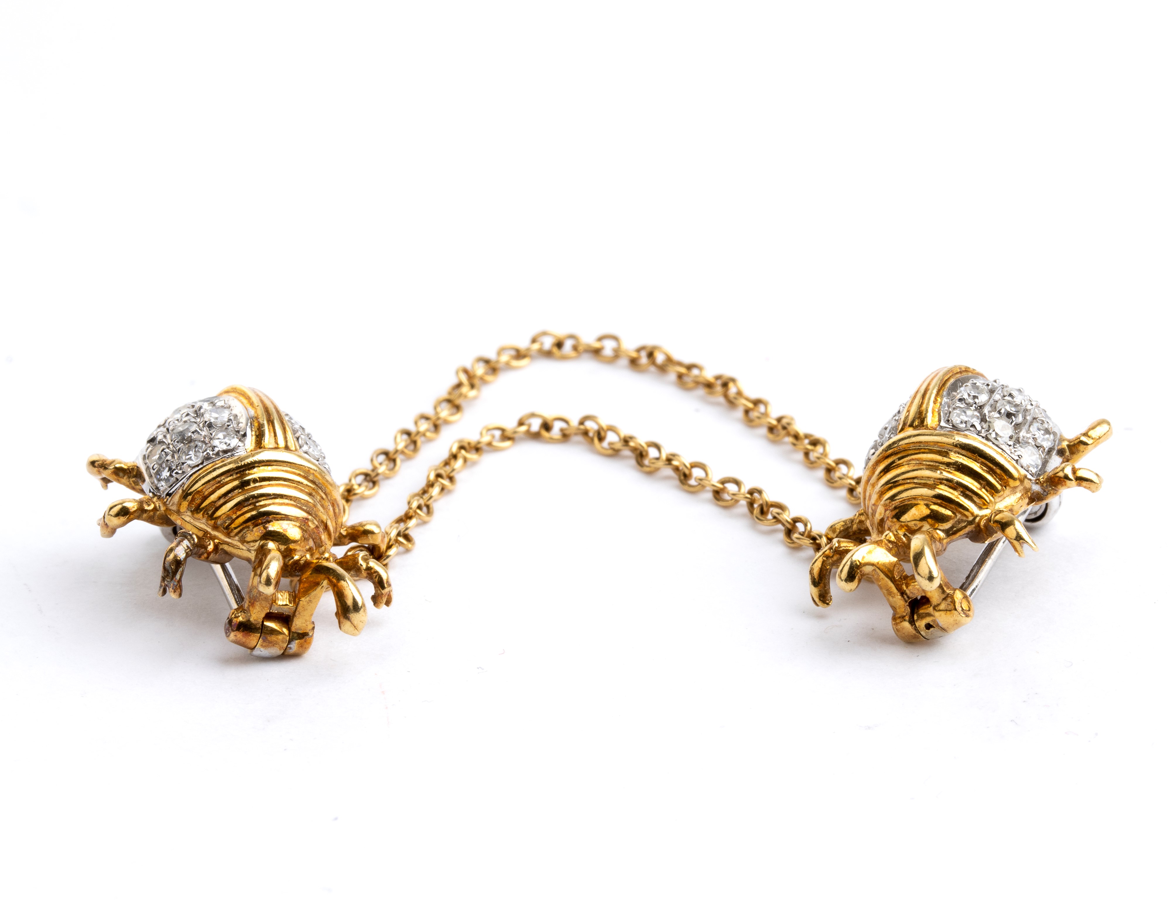 Doppia spilla in oro e diamanti