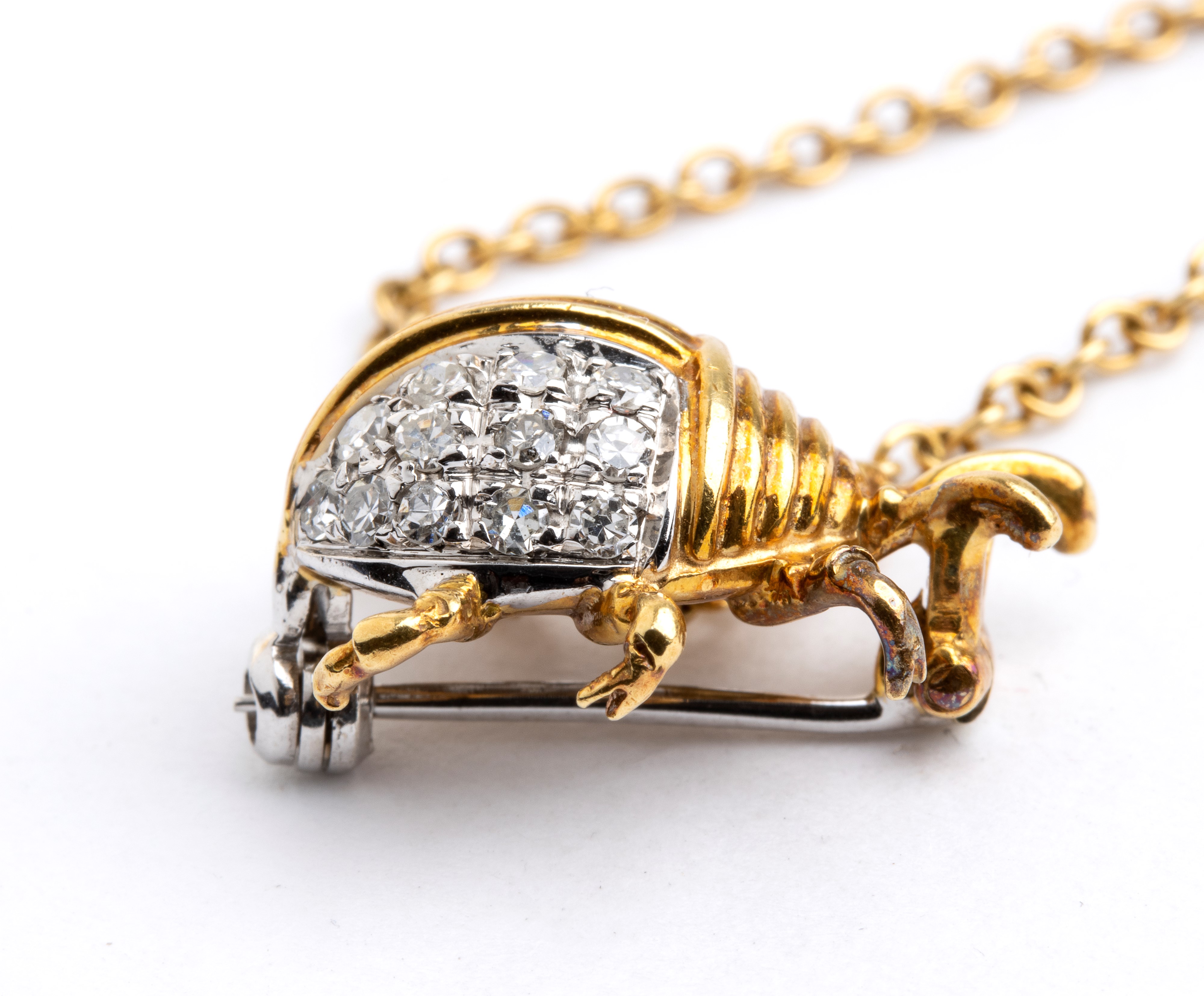 Doppia spilla in oro e diamanti