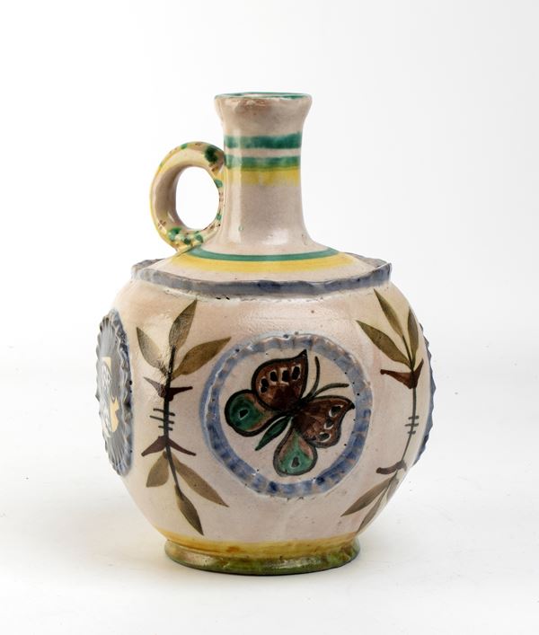 Pourer with relief decoration of animals