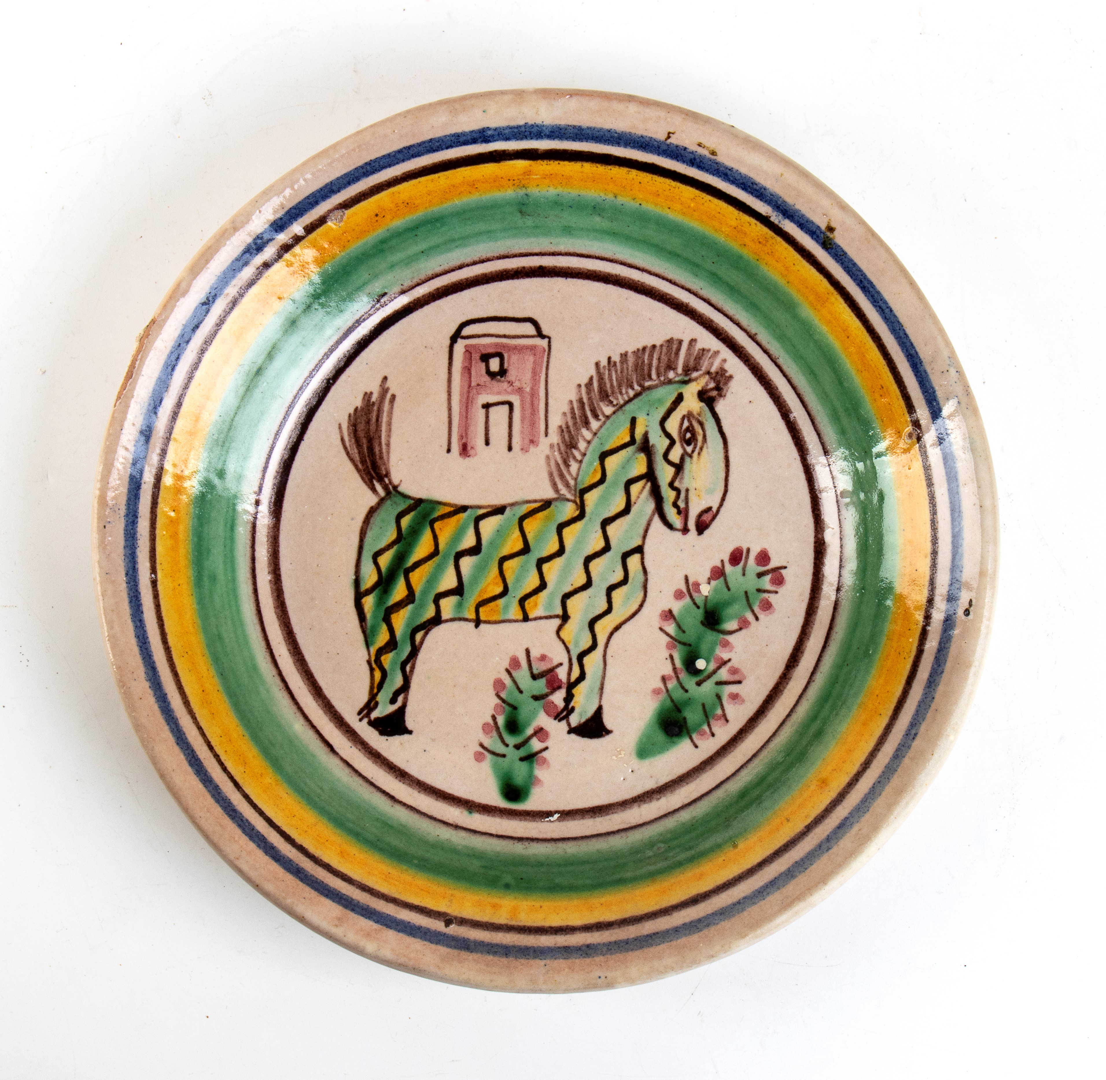 Piatto circolare con decorazione di cavallo a disegni geometrici