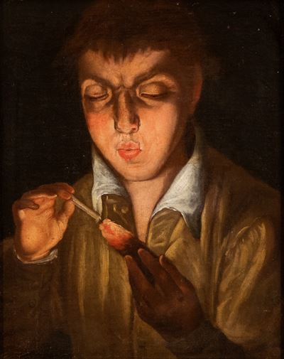 Giovane che Soffia su un Tizzone