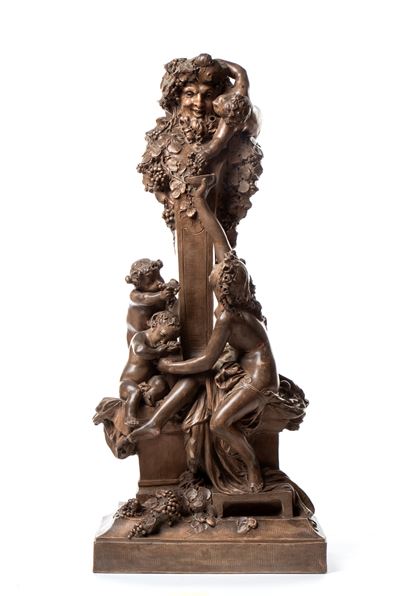 Grande figura in terracotta raffigurante Bacco e una giovane donna