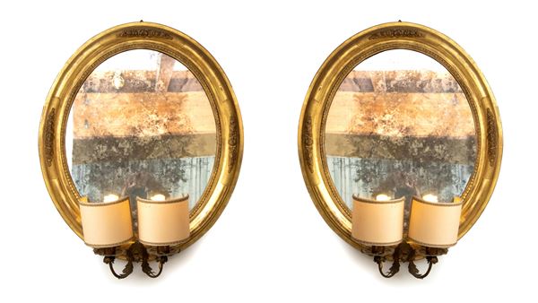 A pair of italian oval mirrors