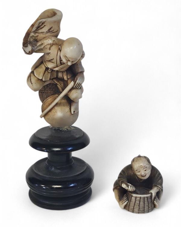 A pair of Japanese ivory okimono