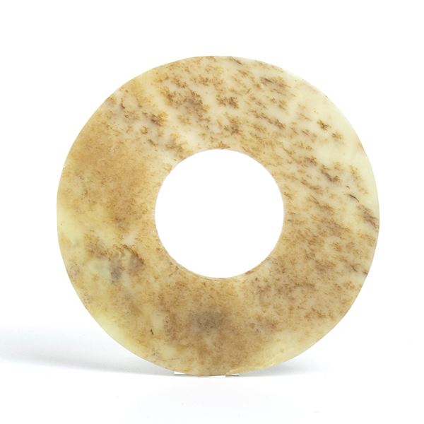 A beautiful Bi disc carved from semi-translucent jade