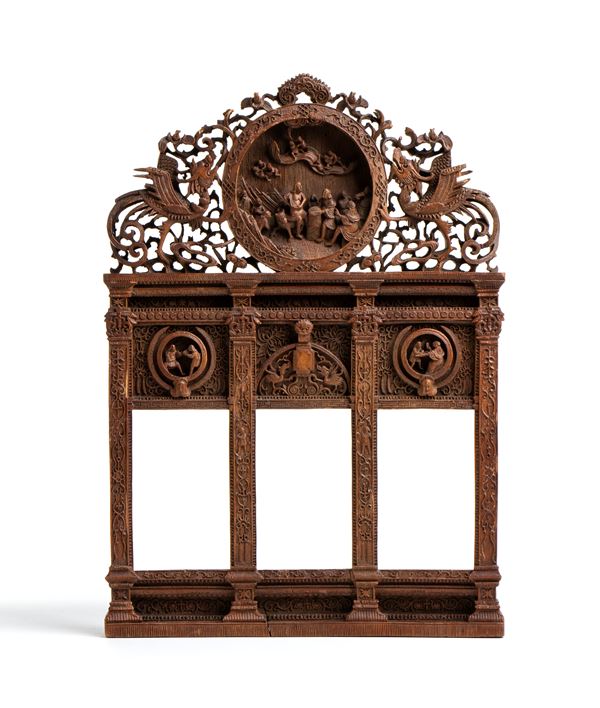 Refined small portal sculpture carved in wood