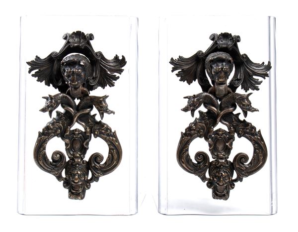 A pair of italian bronze door knockers