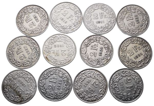 SVIZZERA. Lotto di 12 monete da 2 franchi 1911, 1916, 1920, 1921, 1922, 1926, 1928, 1931, 1936, 1937, 1939, 1940. Conservazioni varie. Ag  - Asta MONETE E MEDAGLIE MODERNE, CONI, PUNZONI E RARITÀ MASSONICHE - Bertolami Fine Art - Casa d'Aste