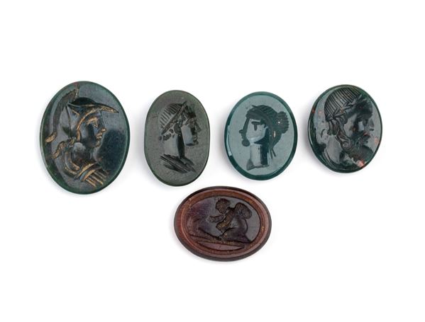 Set of 4 carvings in jasper and moulded glass paste