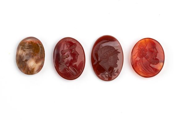 Set of 4 carvings in carnelian and moss agate