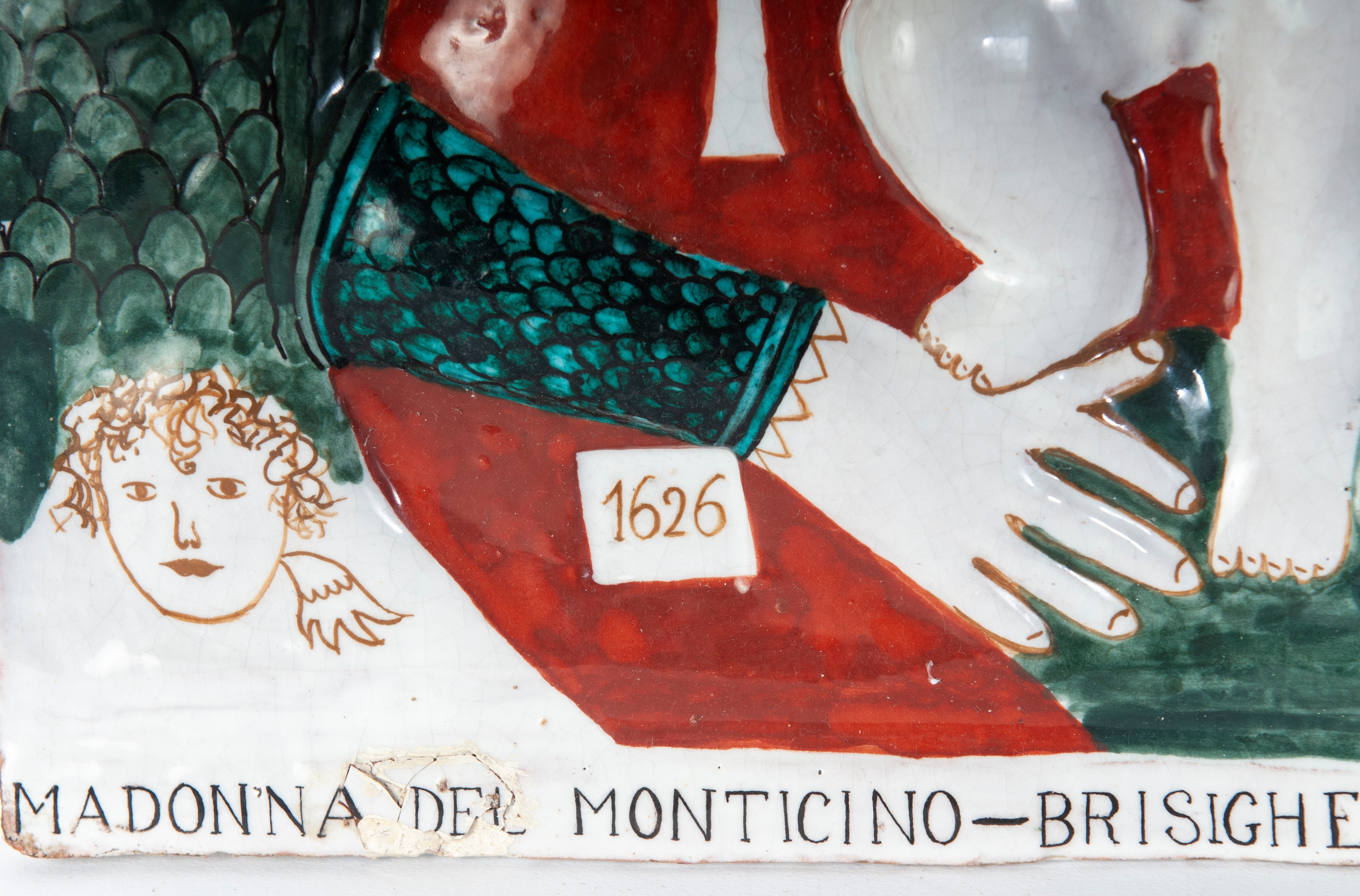 Madonna del Monticino, Rilievo in ceramica policroma