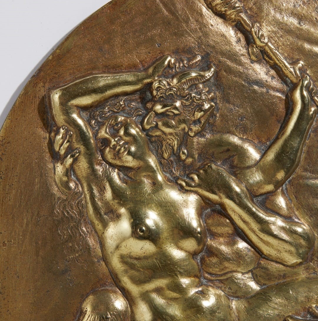 Placca ovale con ninfa e satiri