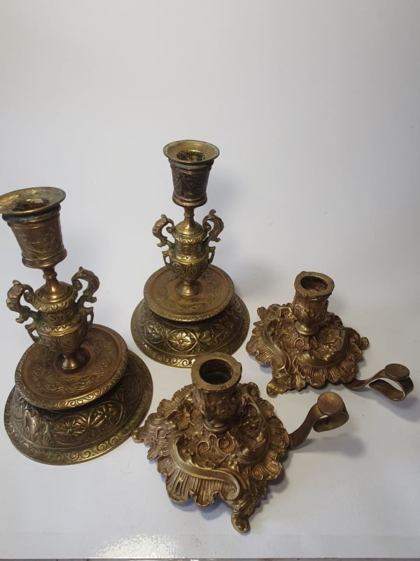 Pair of chamfered candlesticks and pair of baroque candlesticks