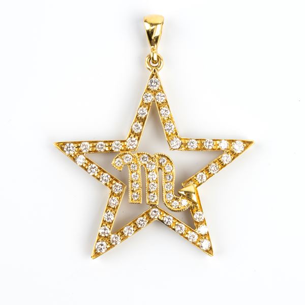 Pendente in oro con simbolo zodiacale in diamanti