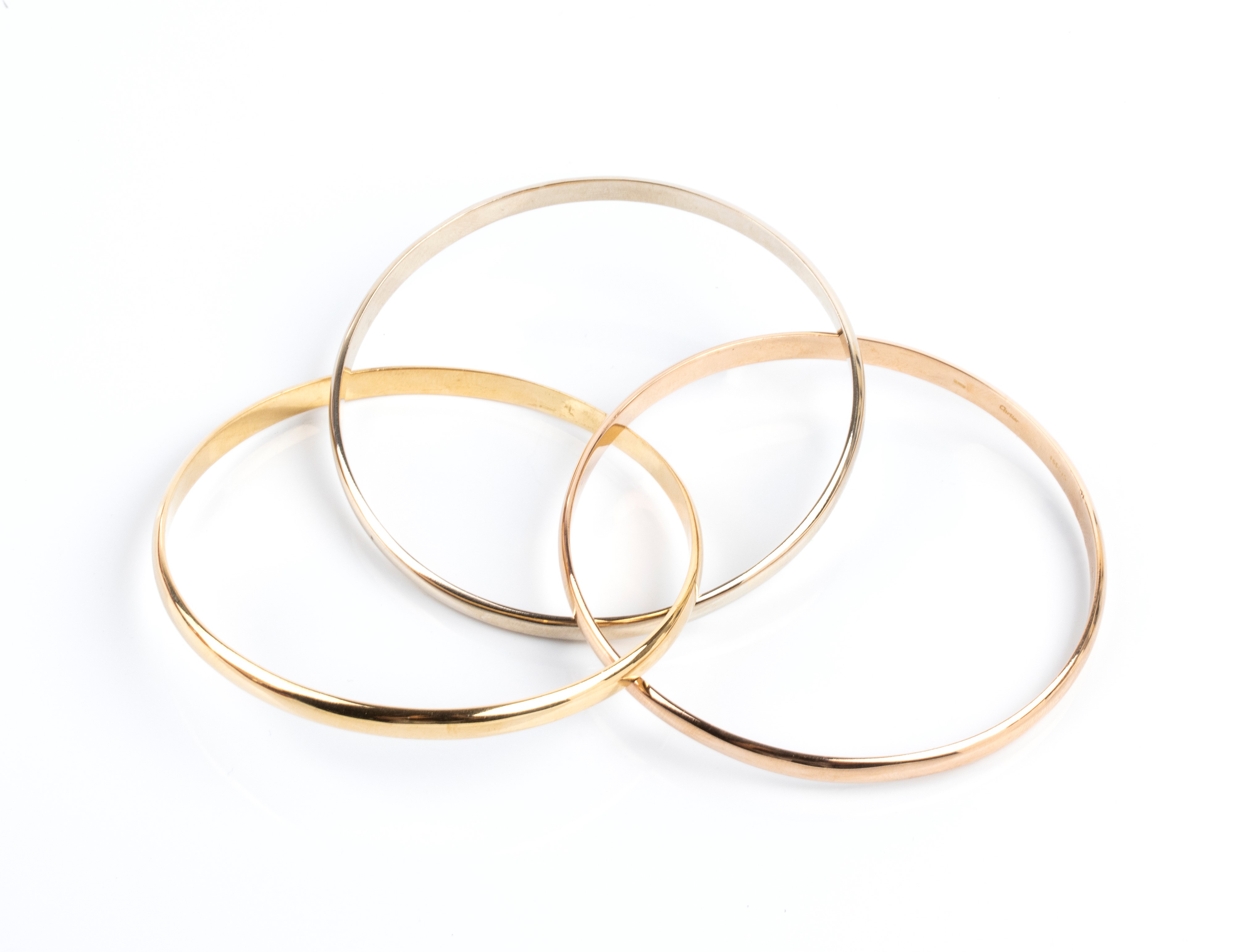 Cartier - Bracciali a cerchio in oro a tre colori 18k con motivo a tre anelli intrecciati