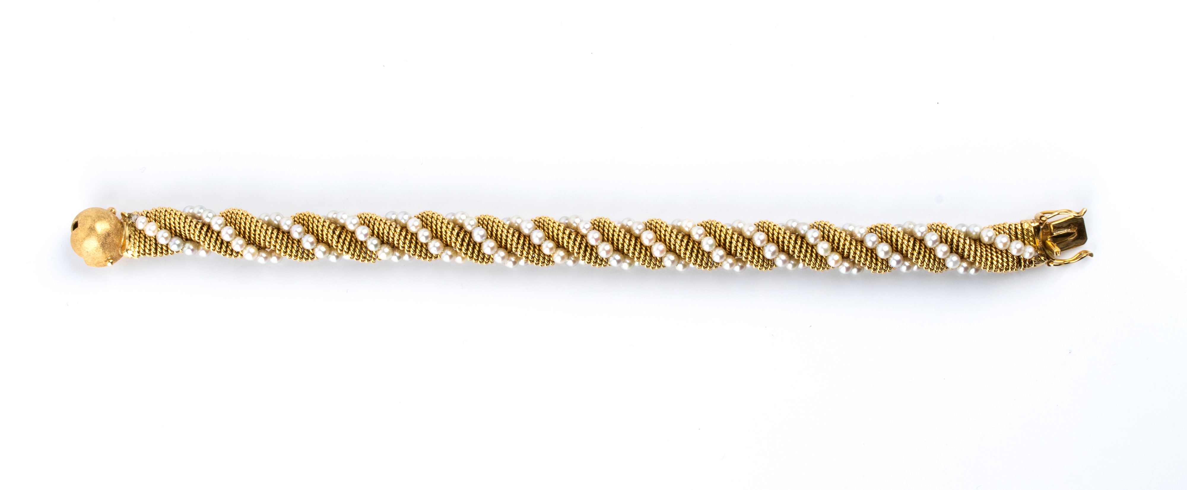 Bracciale in oro giallo 18k con motivo a torsade e perle coltivate d’acqua salata