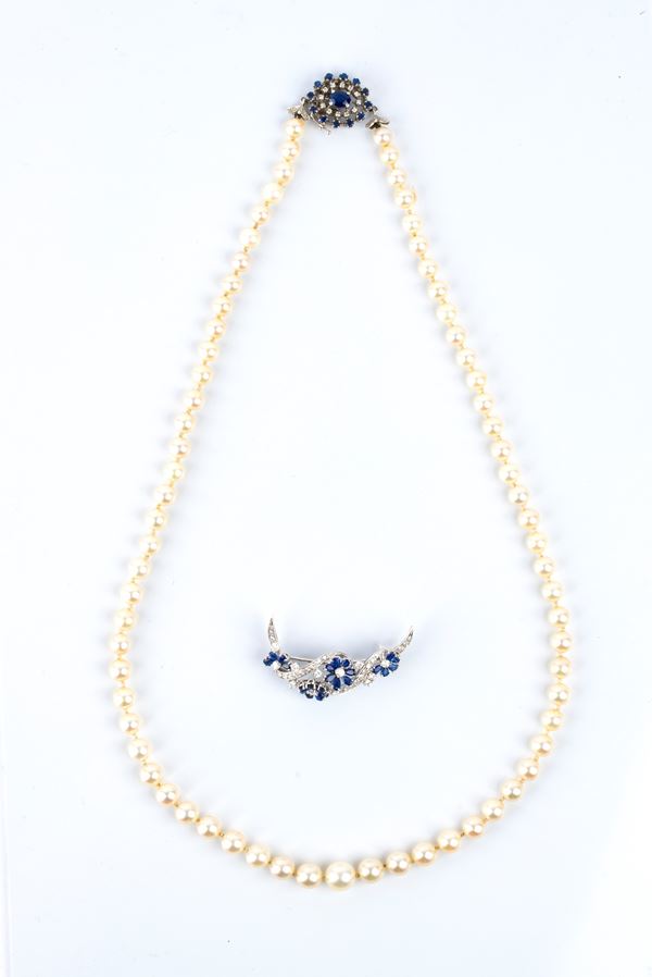 Pearl necklace and gold brooch with diamonds and sapphires