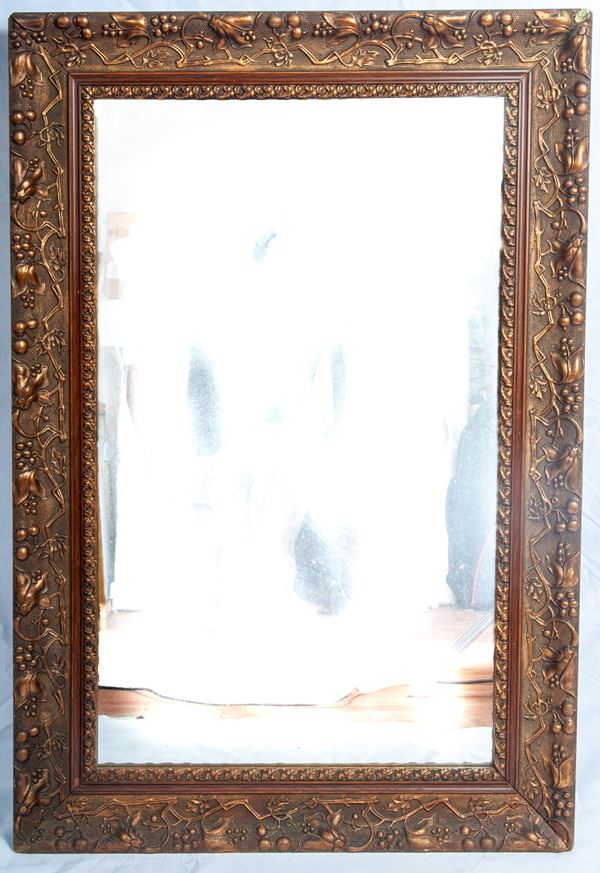 Wall mirror in wood and stucco