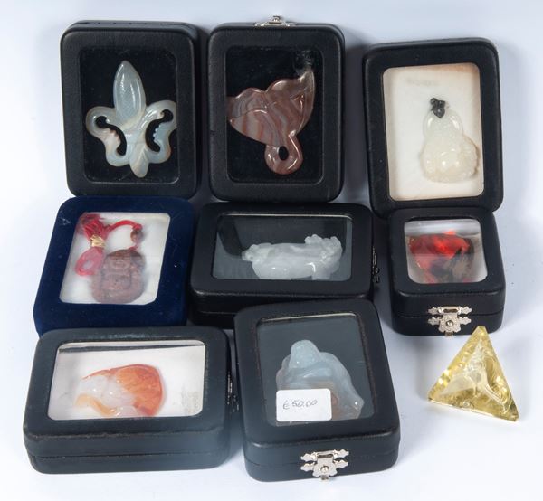 Lot of seven stone sculptures and a smoky quartz