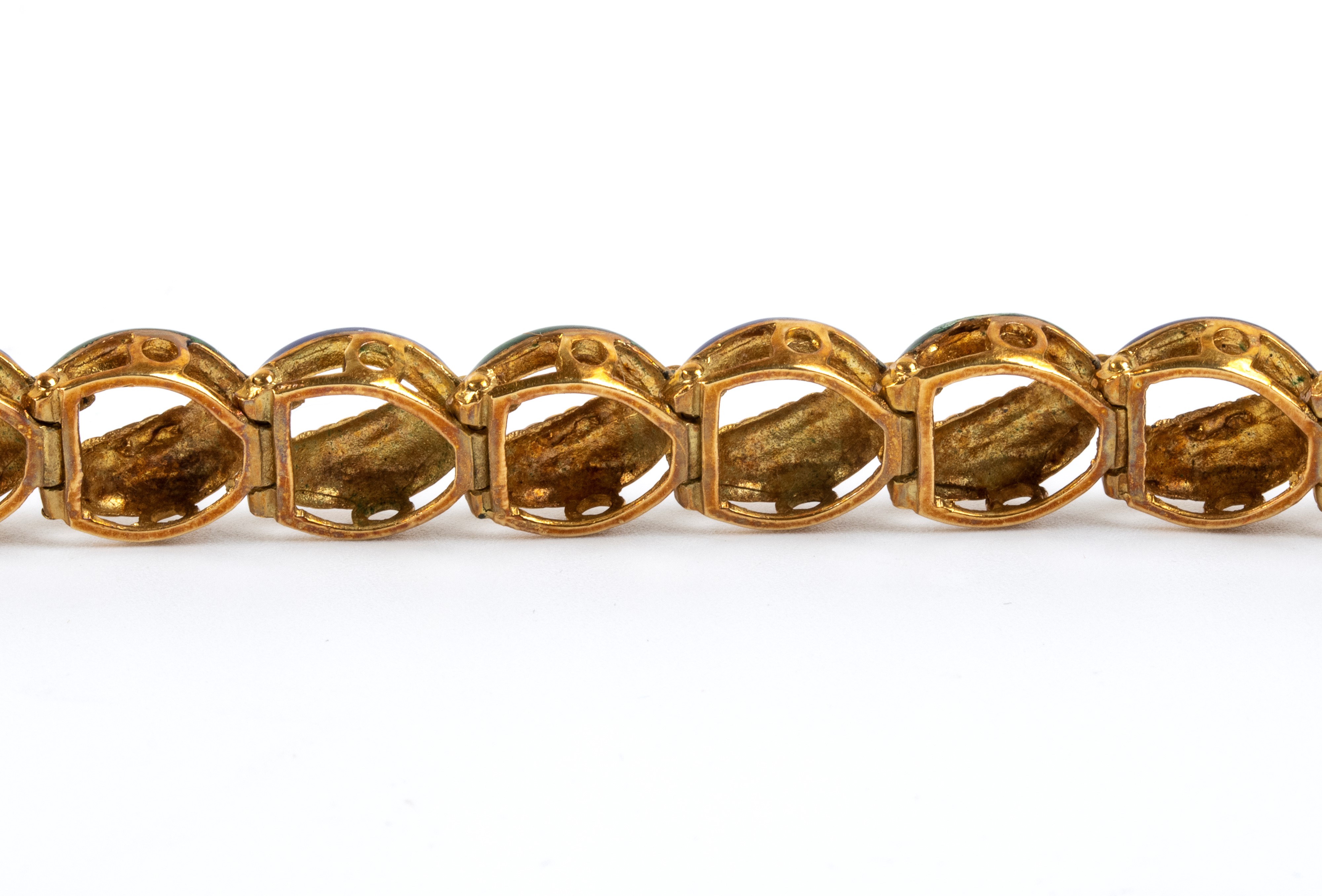 Bracciale in oro giallo 18k e smalti, maglie ad anello con motivo a foglie