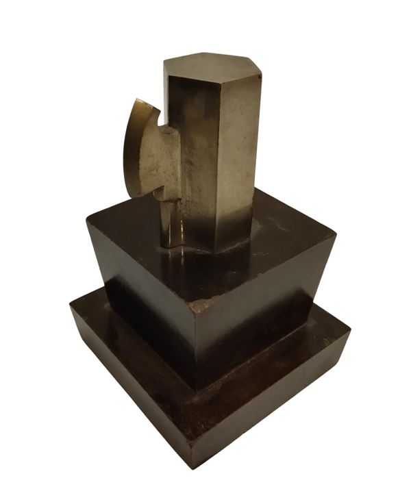 Faceted metal beam on wooden base