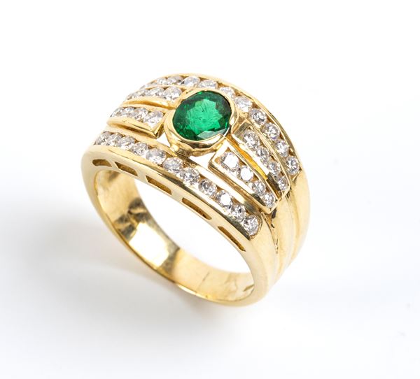 Anello a fascia in oro con smeraldo e diamanti        
