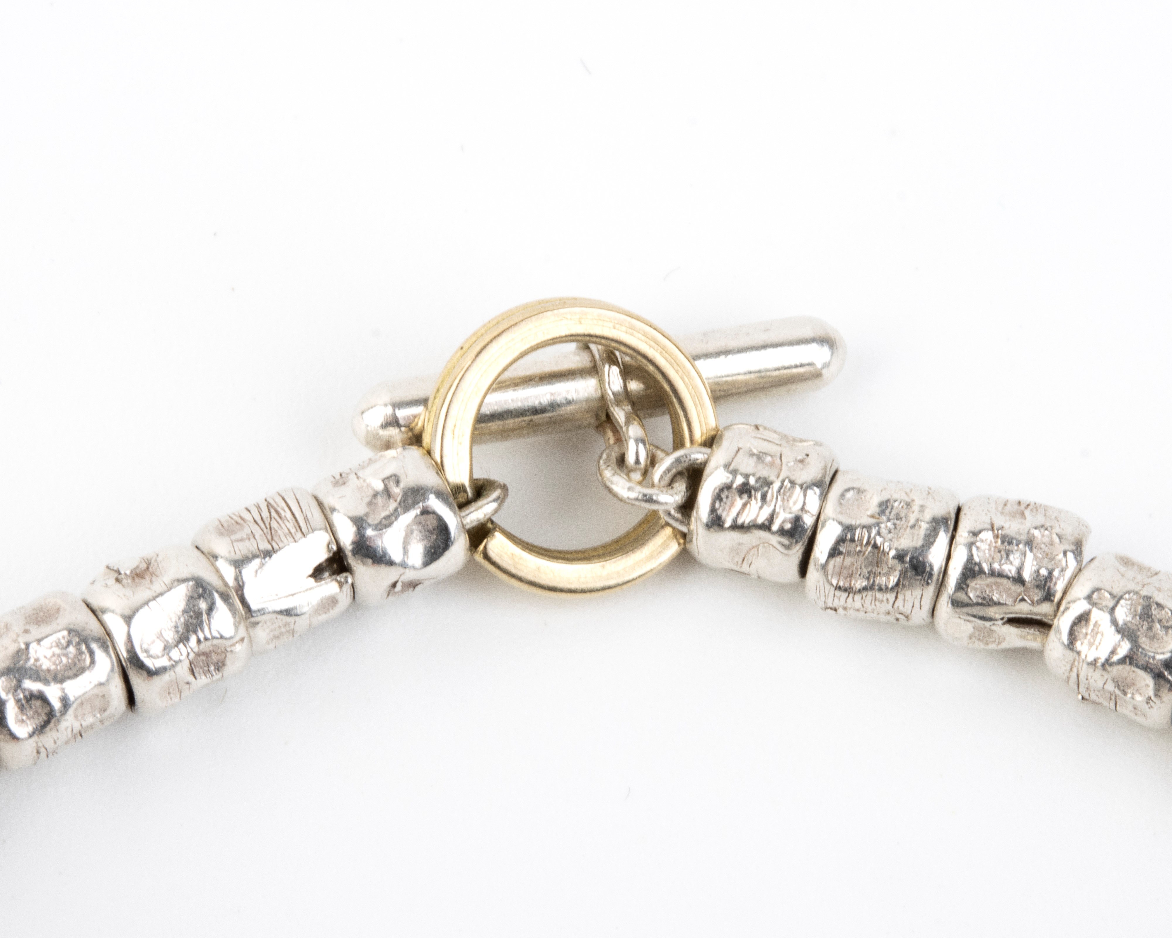 Pomellato - Collezione “Dodo”: bracciale in argento con chiusura ad anello in oro giallo