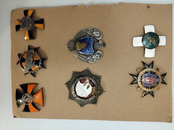 Poland, lot of seven regimental badges in silver-plated metal and polychrome enamel, mainly produced by the Panasiuk company of Warsaw.